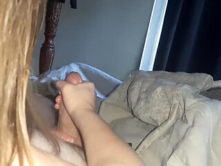 Handjob While Playing in Bed