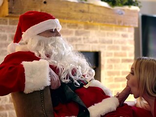 Nikole Nash and Silvia Saige share santas cock in a steamy scene.