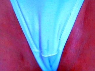 Sexy Latin chick shows off her big round butt in a white thong under a blue dress