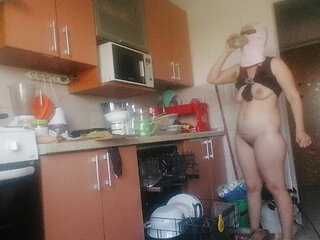 Sexy nude wife preparing food in the kitchen. Hairy brown hair, big ass, big tits