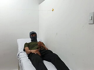 kinky doctor masturbates his cock in the office