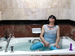 Crossdresser showcases lingerie and enjoys a sissy shower in pantyhose