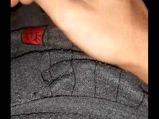 A penis sticking out of a hole in pants