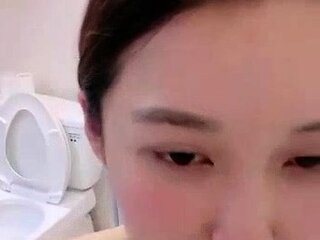 Asian babe sucking and jerking two hard dicks