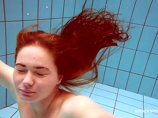 Lola, a young girl with a juicy body, swims naked