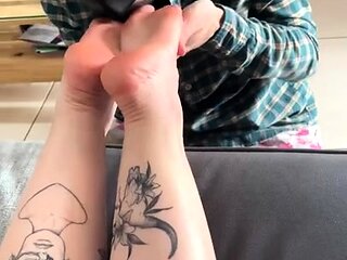 Brunette with foot fetish rubs big dick with her feet in POV