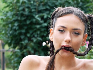 Pigtailed beauty Vixi Rafi fingering herself in a field