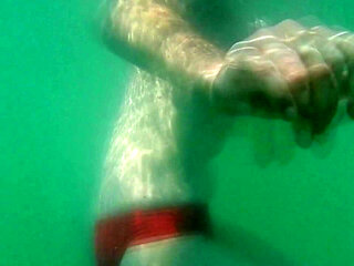 My tits underwater on public beach