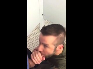 Hunk gives blowjob in a public restroom - amateur gay porn