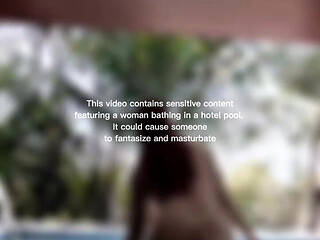 Woman Hijab Bathing Naked in an Open-air Hotel Pool