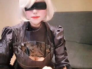 2B cosplayer stimulates her fat cock while deepthroats too deeply that bursts into tears.