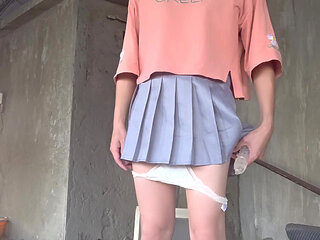 A Pleated Skirt Paired with White Underwear, and an Anal Plug Inserted on the Terrace
