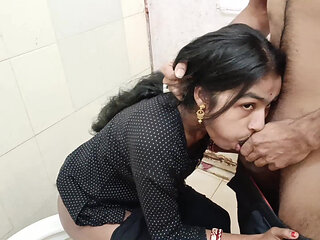 While Bhabhi was sitting on the toilet doing potty, I was watching porn and fingering her pussy.