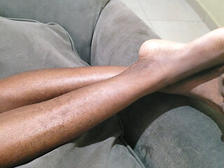 A Woman with Lots of Beautiful Pubic Hair Between Her Legs Lies on Her Sofa Waiting to Be Made Love to Her