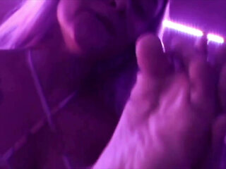 Young Girl Using Her Feet to Play with the Dildo While Masturbating