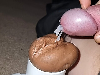 Slow motion cumshot into sex toy