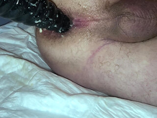 Point of view of grandpa's anal from the side with his black dildo