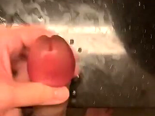 rubbing my big swollen cock head until i sprayed all over the table