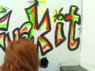 Redhead with big tits sucks dick through a glory hole
