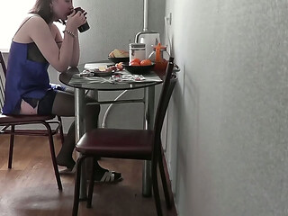 Typical morning of sexy cute beautiful girl. Sweet Assol with beautiful legs and butt in erotic lingerie peignoir stockings in kitchen preparing coffee and breakfast. Beautiful ass