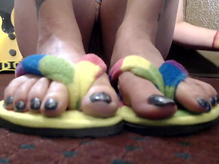Closeup toe wiggling flip flops nude