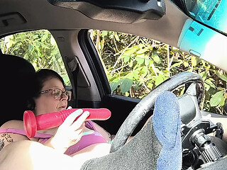 She teases his cock with dirty moves in the backseat