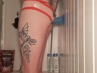 Skinny tattooed boy in shower playing with his dildo