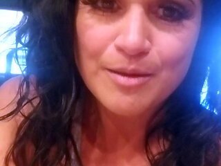 Busty curly brunette with big boobs fucks on couch