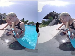 Brunette lesbian babes share a wet pool fuck session