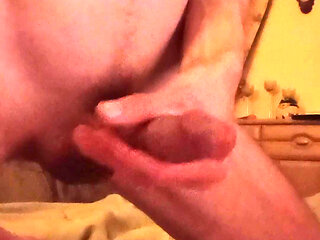 Stroking my big cock on a boring night until i cum.