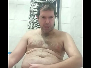 Masturbating a big cock in the bathroom