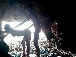 Couple recorded at the beach, inside the cave