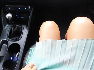 Mature aunt shows off her sexy legs while teasing her stepson in the car.