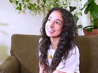 Sexy dark-haired toys with a wand and flashes off her