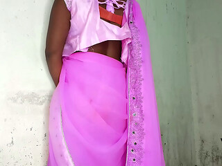 I am an Indian woman ready to have sex while wearing a pink Indian saree.