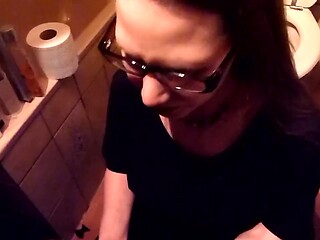 Glasses-wearing librarian drinks piss from a submissive slut