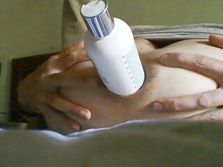 Young man pleasures himself in his bed