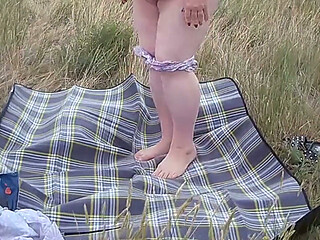 Bitch Masturbates Pussy With a Toy in the Field