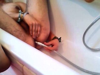 Twink Uses Shower Head for Enema and Masturbates