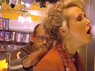 German MILF gets her tight ass fucked at a porn shop