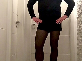 Nicki crossdress black knitted dress, tights and Chelsea boots
