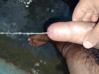 Indian Bisexual Nikhil, peeing with a had dick