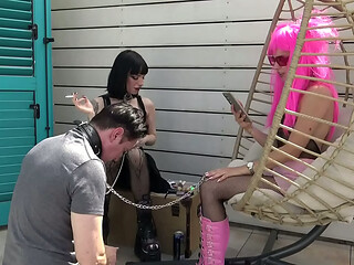 The sassy, kinky fetish girls dominate and humiliate their slave outside on the ground