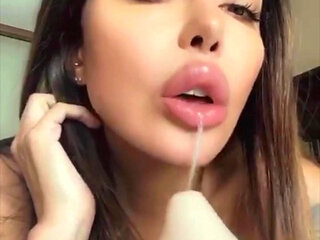 Lela Star sucks her own nipples and fucks her tight pussy with a huge dildo