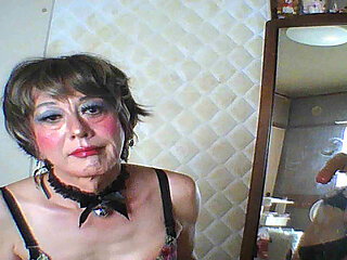 The cross-dresser puts a glass ball in her anus and writhes.