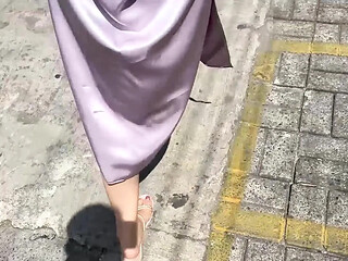 Asian girl with big ass in public exposes her satin skirt