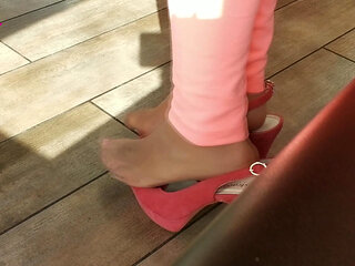 Shoeplay with High Heels in a Bar