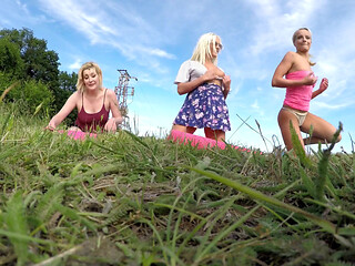 Outdoor fitness in shortest skirts on a windy day