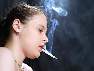 Topless Brunette Smoking in Dramatic Smoke