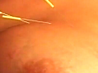 Busty Blonde MILF Submits to Intense Needle Play